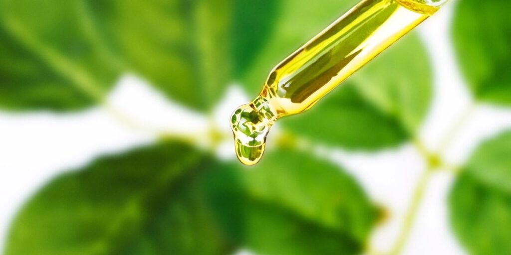 Micellar skincare - dropper with plant background