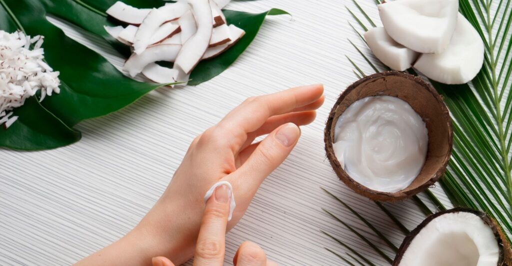 Micellar skincare - hand with coconut fruit and leaves